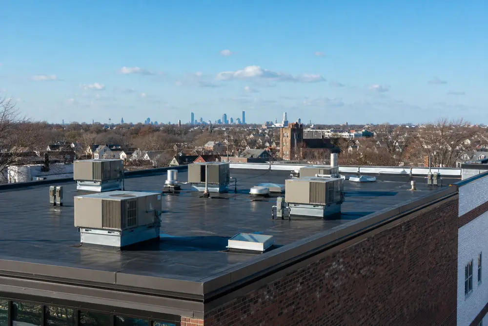 Rooftop HVAC units on a small commercial building near Boston