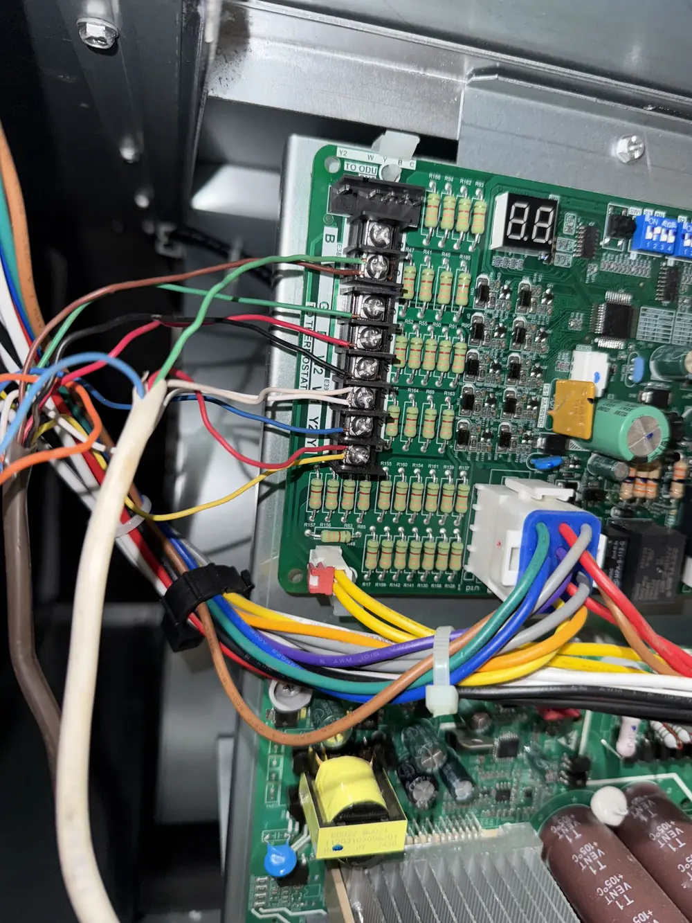 HVAC control board with low-voltage wiring connected at the terminal strip