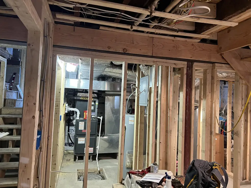 Ductwork and equipment visible through framing during construction