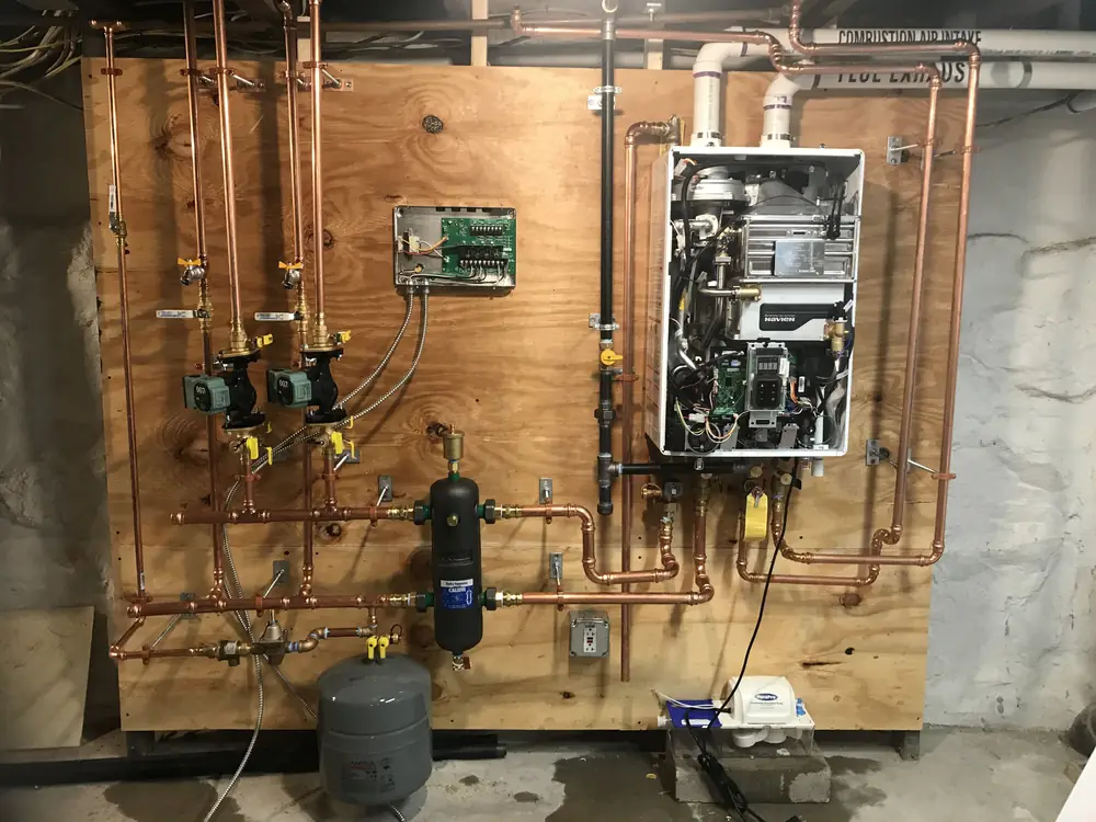 Navien boiler with the front cover removed showing internal components